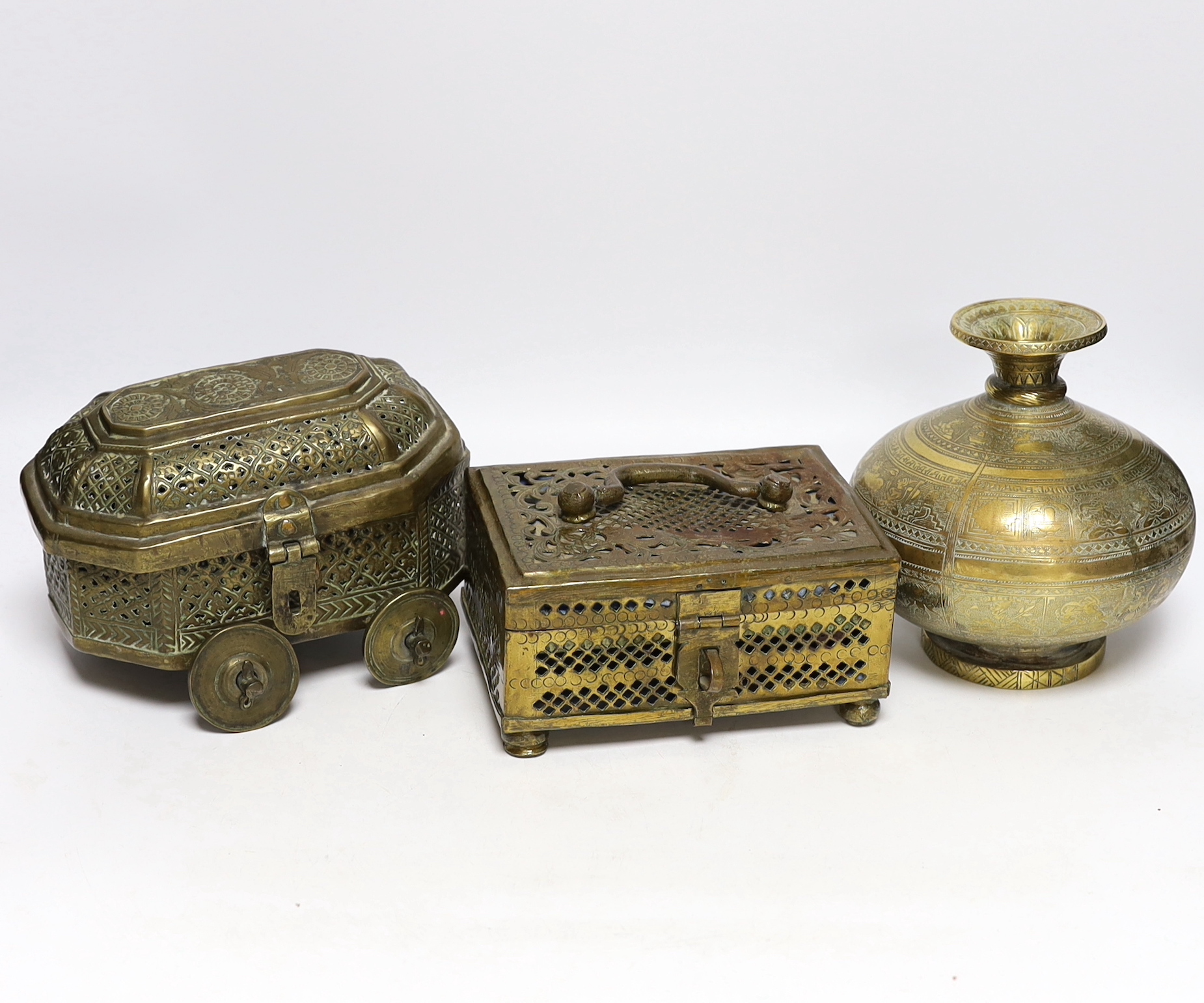 Eastern brassware to include a betel box on wheels, a vase with engraved detail and a pierced box, tallest 15.5cm (3)